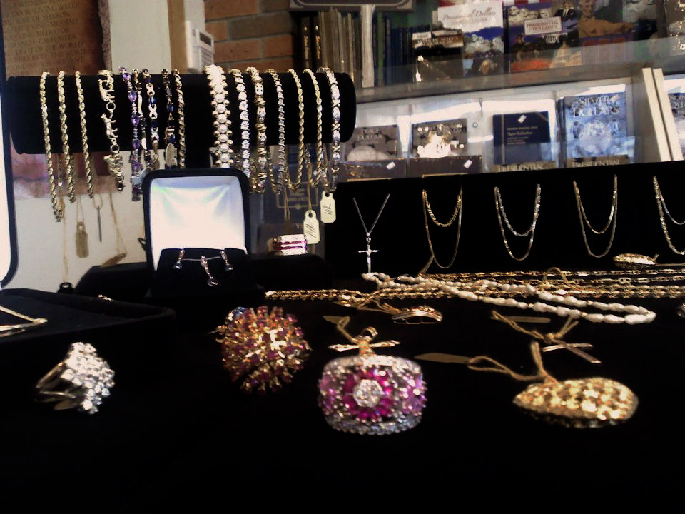 Gold and silver jewelry shown in store display showcase